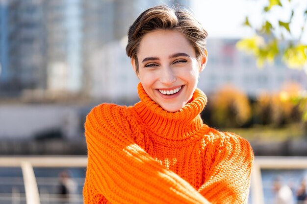 Beautiful young woman with short hair in the city