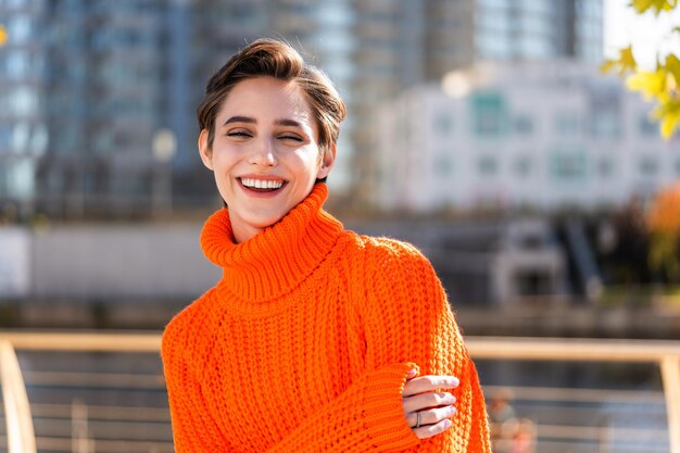 Beautiful young woman with short hair in the city