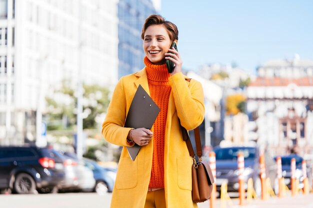 Beautiful young woman with short hair in the city