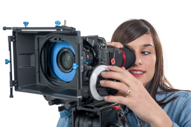 Beautiful young woman with SLR video camera