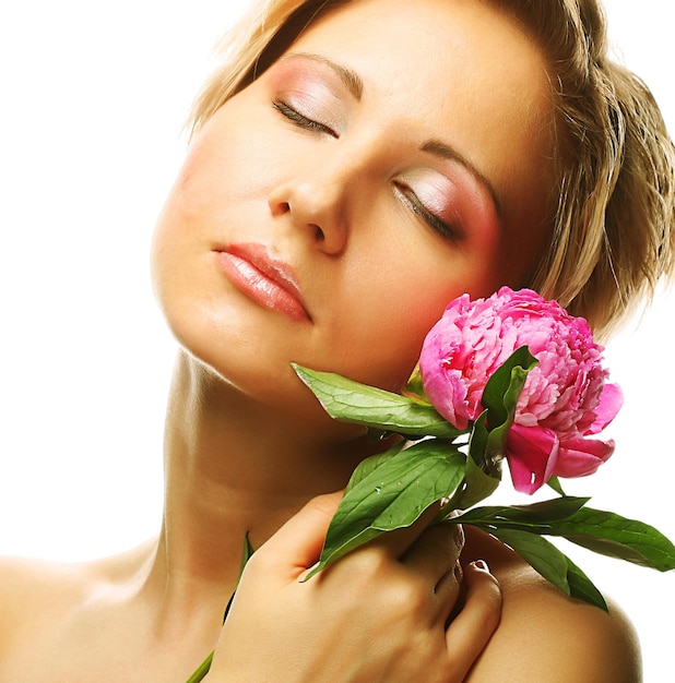 Beautiful young woman with tree-peony flower