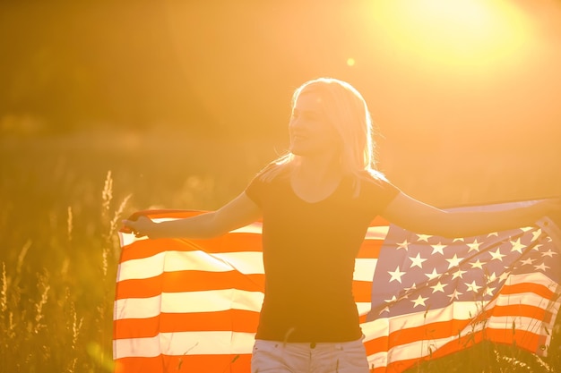 Beautiful young woman with usa flag