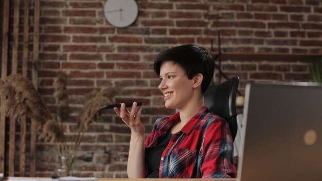 Beautiful young woman working on laptop