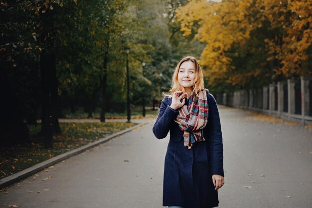 Beautiful young women in the autumn park