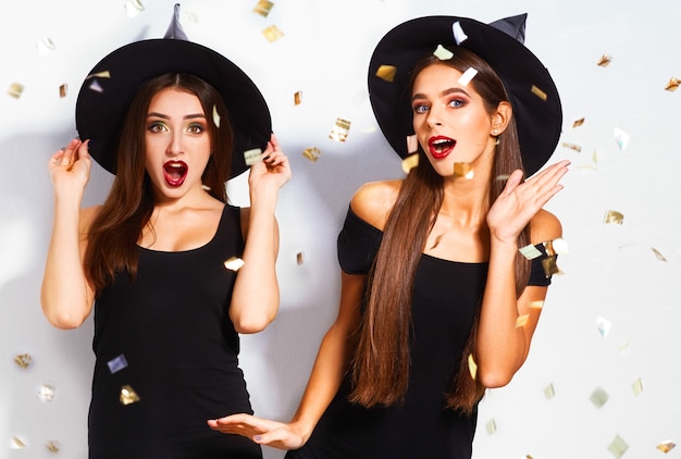 beautiful young women dressed as a witch for Halloween party