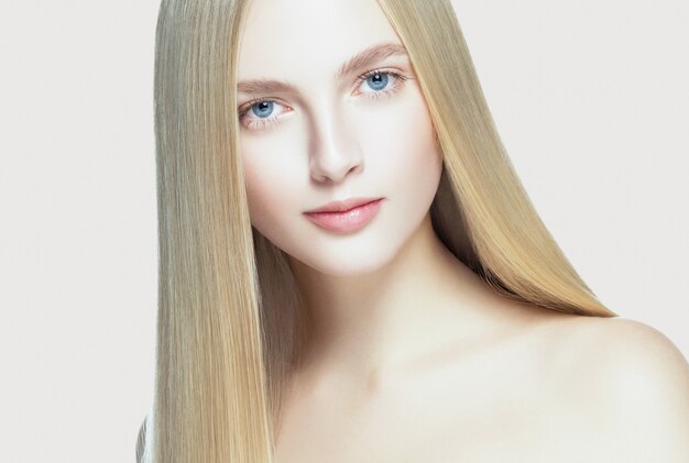 Beautifulhairwoman blonde hairstyle model long hair healthy skin. Studio shot.