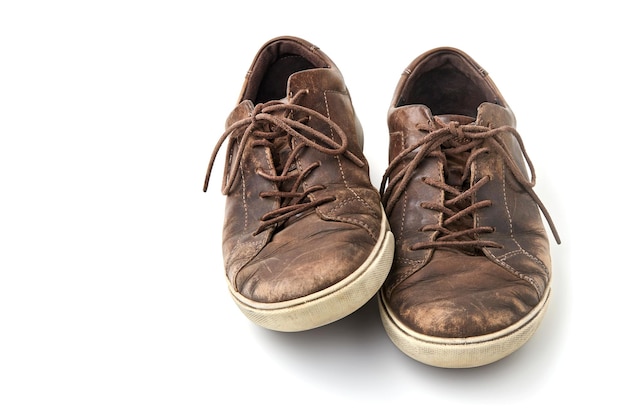 Beautifully aged vintage brown leather boots isolated on white background