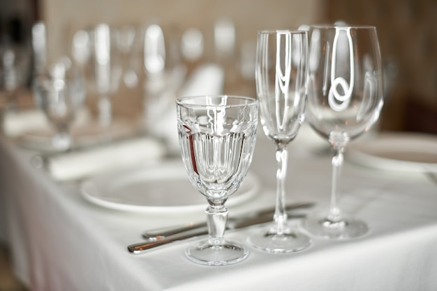 beautifully decorated festive table with plates and glasses in a restaurant