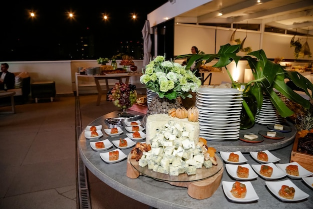 Beautifully decorated food table for events with cheese and lamb carret.