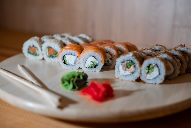 Beautifully laid out sushi on a wooden stand