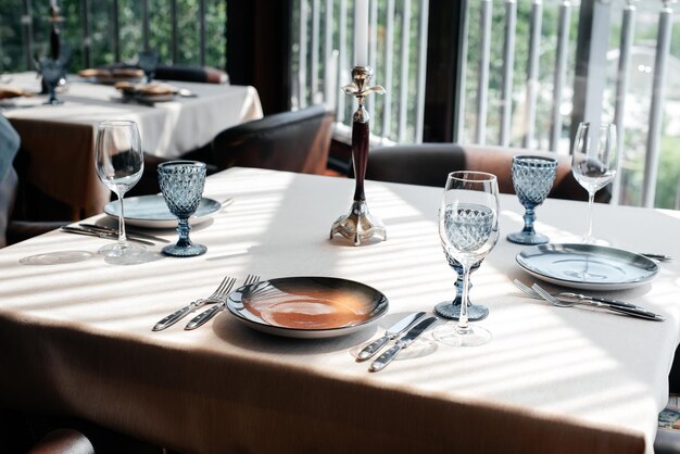 A beautifully laid table with exquisite dishes in a modern restaurant