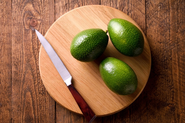 Beautifully plated avocado toast with delicious-looking toppings on wooden table