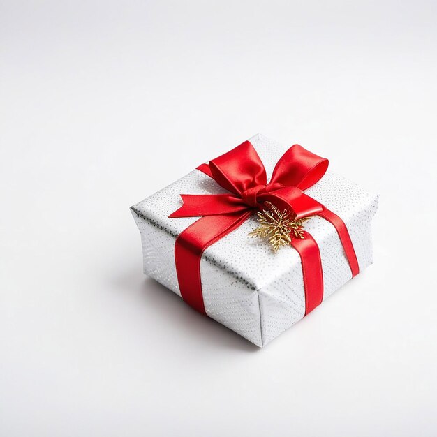Beautifully wrapped gift with a red bow Merry Christmas on a white background