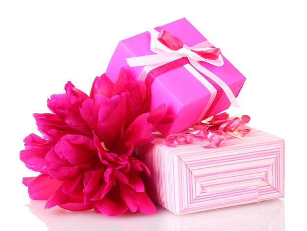 Beautirul pink gifts and peony flower isolated on white