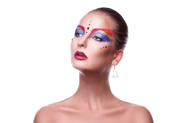 Beauty adult girl with multicolor make up looking away