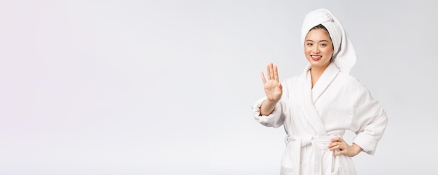 Beauty asian girl who checks her skin skin care Isolated over white background