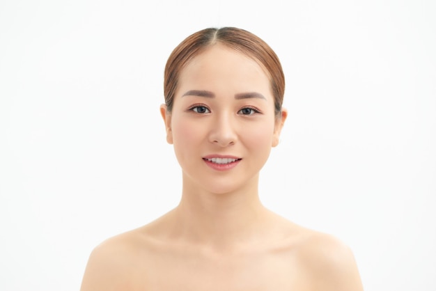 Beauty Asian Woman face Portrait. Beautiful Spa model Girl with Perfect Fresh Clean Skin. Youth and Skin Care Concept. Isolated on a white background