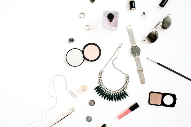 Beauty blog concept. Female make up accessories: watches, necklace, lipstick, shoes, sunglasses on white background. Flat lay, top view trendy fashion feminine background.