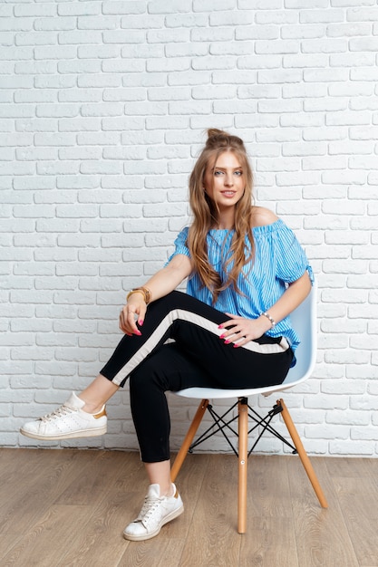 Beauty brunette woman on chair