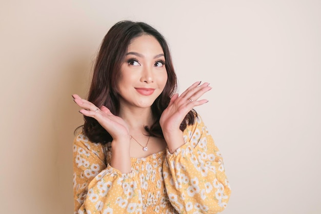 A beauty cheerful face of Asian young model wearing yellow floral top Skincare beauty facial treatment spa female health concept