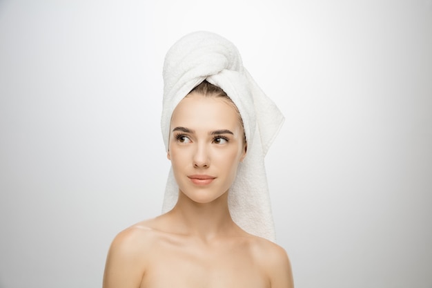 Beauty day woman wearing towel isolated on white studio background