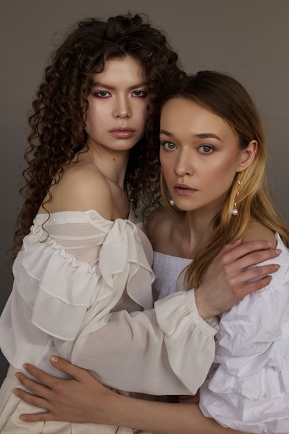 Beauty diversity: blonde and brunette young girls