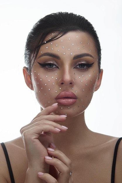 Beauty face woman makeup rhinestones lips Contrasting portrait of a beautiful woman wet hair styling Clean facial skin