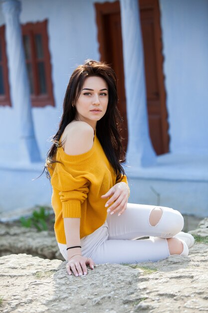 Beauty fashion portrait of young beautiful brunette woman with long black hair and green eyes