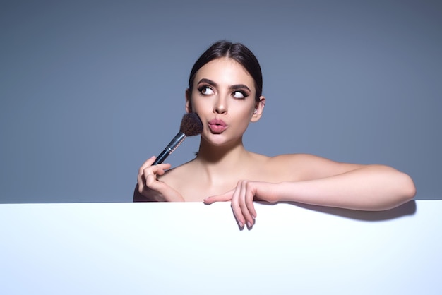 Beauty girl with makeup brushes make up for woman girl with makeup brushes near face cosmetic brush