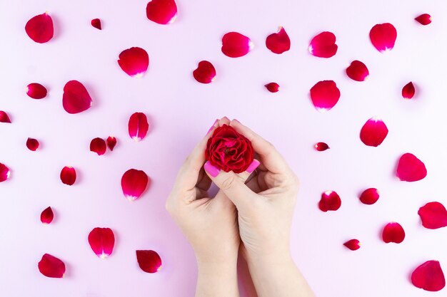 Beauty hands with makeup flowers