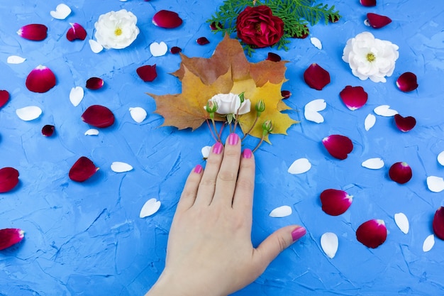 Beauty hands with makeup flowers