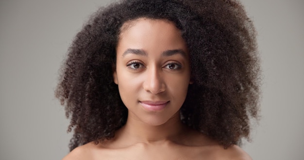 beauty and healthcare beautiful african american woman with curly afro hairstyle and clean healthy