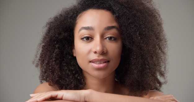 beauty and healthcare beautiful african american woman with curly afro hairstyle and clean healthy