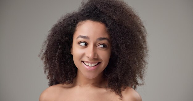 beauty and healthcare beautiful african american woman with curly afro hairstyle and clear healthy
