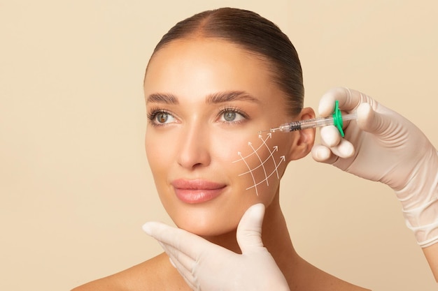 beauty injections lifting lines on young womans face showing skin tightening and face contour