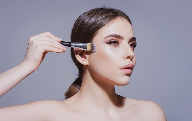 Beauty Makeup and cosmetics Woman with makeup brush Visage Skincare treatments