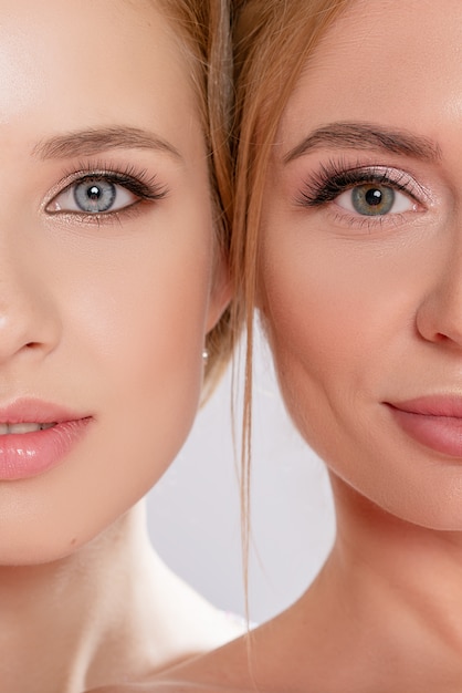 Beauty and makeup of the face of a gorgeous brunette woman and blonde woman