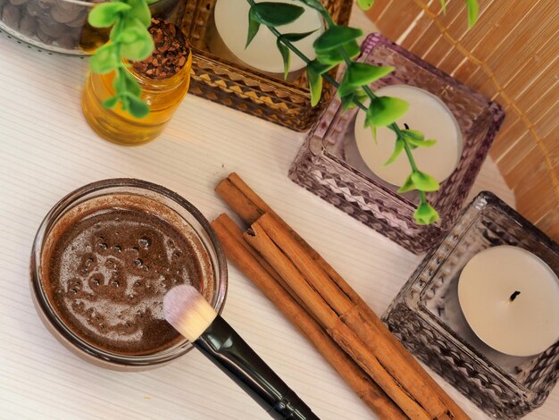 Beauty mask of cinnamon honey and olive oil cinnamon sticks candles View from above