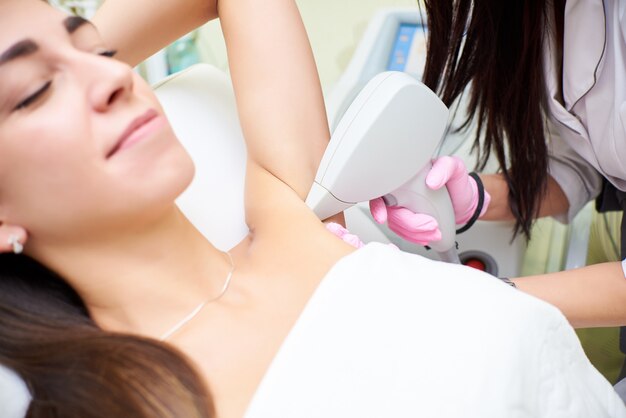 Beauty parlor, laser hair removal, doctor and patient
