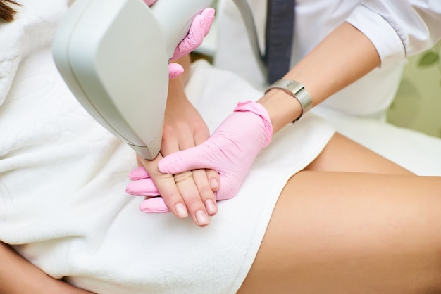 Beauty parlor, laser hair removal, doctor and patient