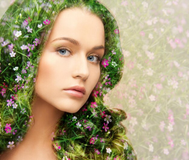 Beauty, people and health concept - young beautiful woman with floral pattern and double exposure effect background