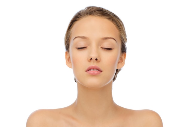 beauty, people and health concept - young woman face with closed eyes and shoulders