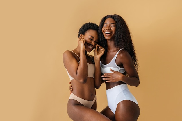 Beauty portrait of beautiful black women wearing lingerie underwear Pretty african young women posing in studio concepts about beauty cosmetology and diversity