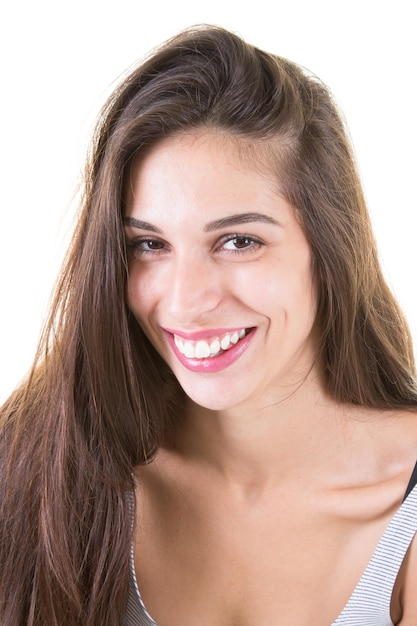 Beauty portrait of beautiful young brunette woman looking at camera smiling