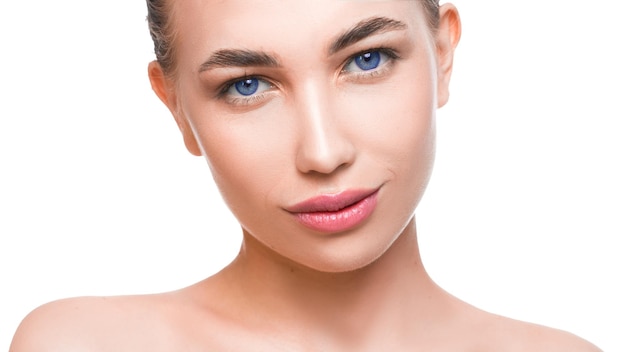 Beauty portrait of a blue eyed young woman looking at camera