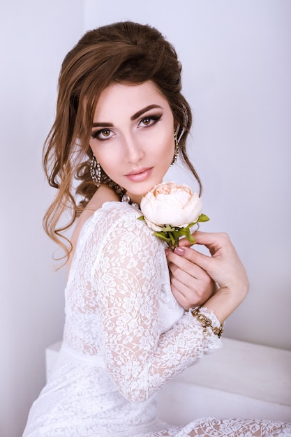 Beauty Portrait of bride wearing in wedding dress with voluminous skirt, studio photo