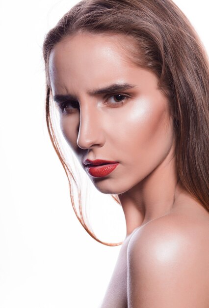 Beauty portrait of emotional brunette woman with red lips and naked shoulders