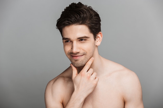 Beauty portrait of half naked smiling young man