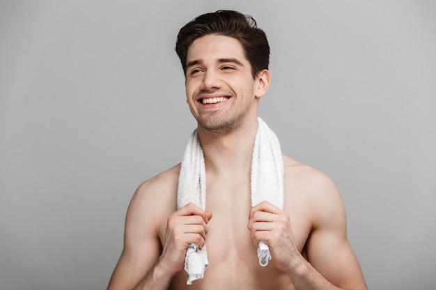 Beauty portrait of half naked smiling young man