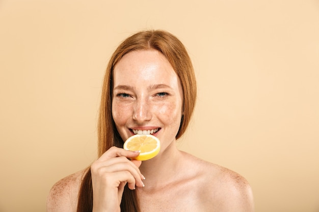 Beauty portrait of a happy young topless redhead girl